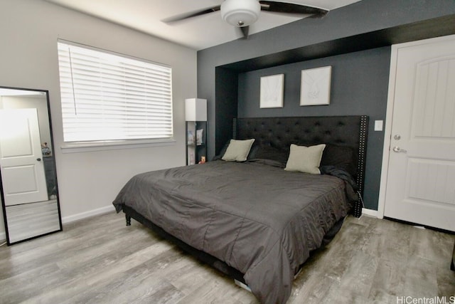 bedroom featuring ceiling fan and light hardwood / wood-style flooring