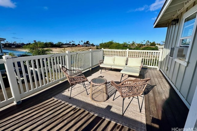 deck with an outdoor hangout area and cooling unit