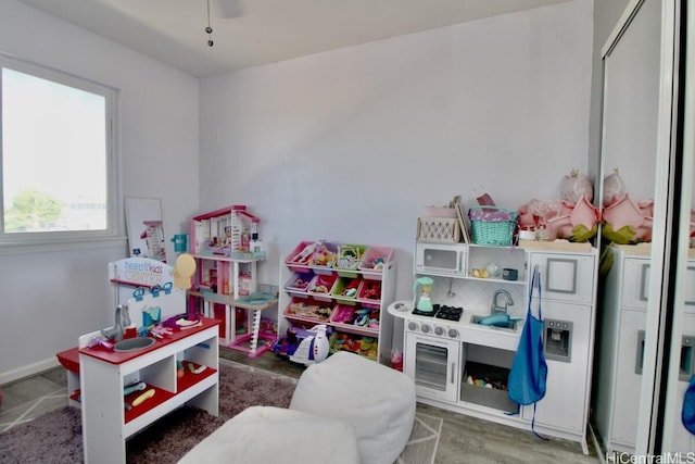 playroom featuring independent washer and dryer