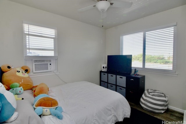 bedroom featuring ceiling fan and cooling unit