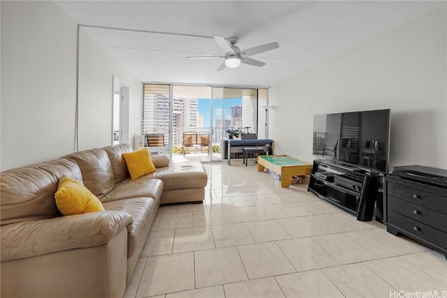 tiled living room featuring floor to ceiling windows and ceiling fan