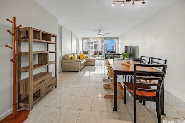 dining room with ceiling fan and floor to ceiling windows