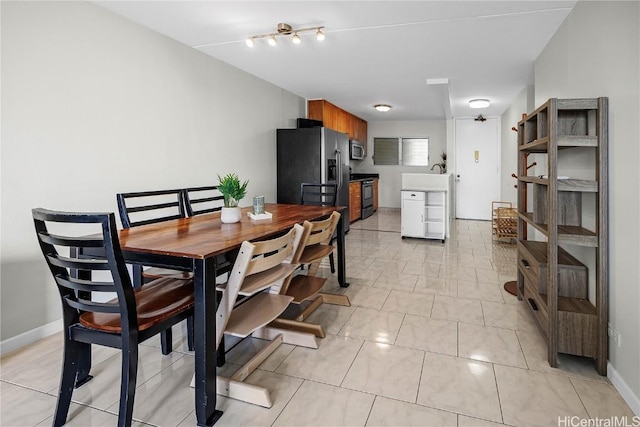 dining room featuring light tile patterned floors