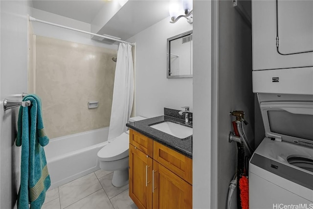 full bathroom featuring shower / bath combo, tile patterned floors, vanity, toilet, and stacked washer / drying machine