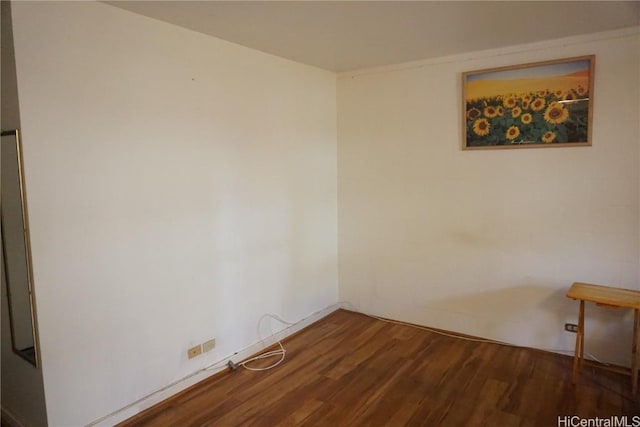 empty room featuring dark hardwood / wood-style flooring