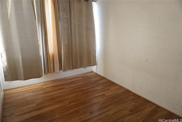 empty room with dark wood-type flooring