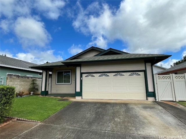 ranch-style home with a garage and a front lawn