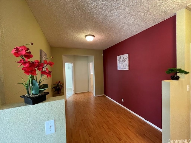 interior space featuring hardwood / wood-style floors and a textured ceiling