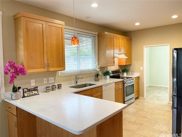 kitchen with white dishwasher, black refrigerator, sink, stainless steel electric range oven, and kitchen peninsula