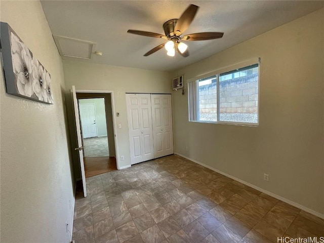 unfurnished bedroom featuring a wall mounted AC, ceiling fan, and a closet