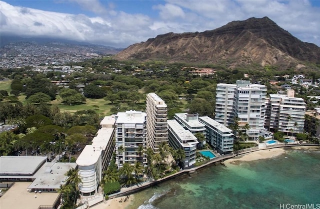 birds eye view of property with a mountain view