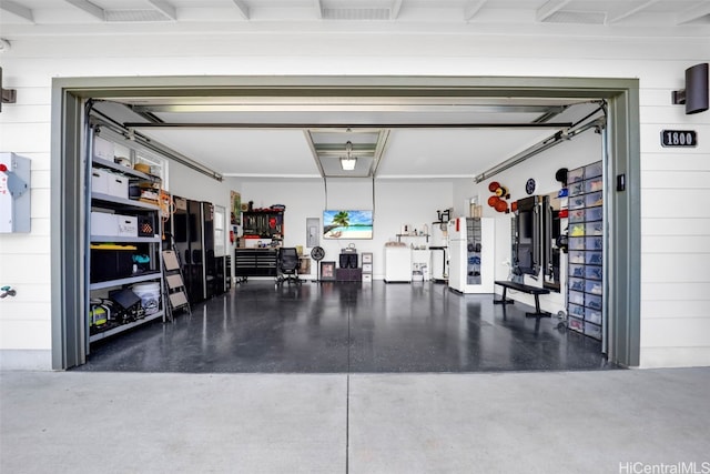 garage featuring wood walls