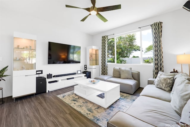 living room featuring dark hardwood / wood-style flooring and ceiling fan