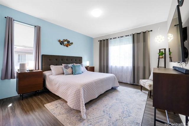 bedroom featuring dark wood-type flooring