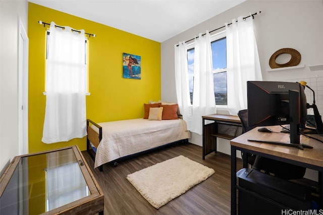 bedroom featuring dark hardwood / wood-style flooring