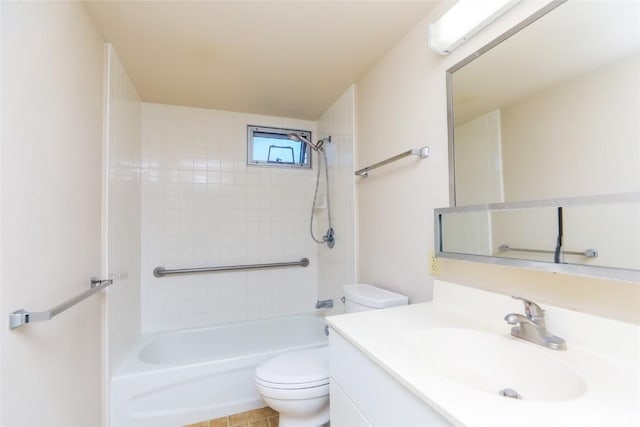 full bathroom featuring vanity, toilet, and tiled shower / bath