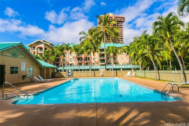 view of swimming pool featuring a patio area