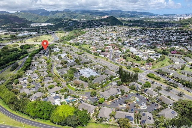 birds eye view of property with a mountain view