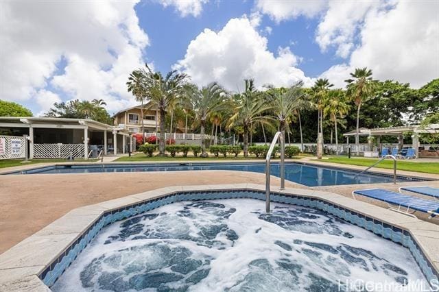 view of swimming pool featuring a community hot tub