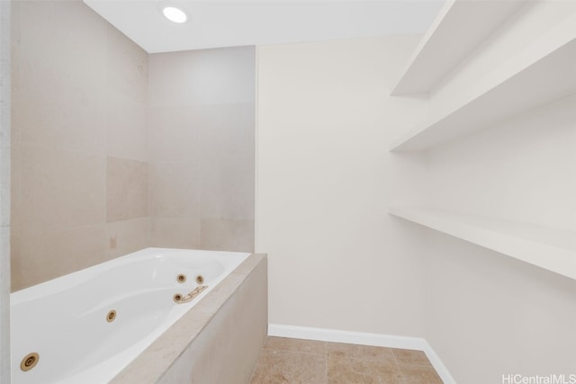 bathroom with tiled tub