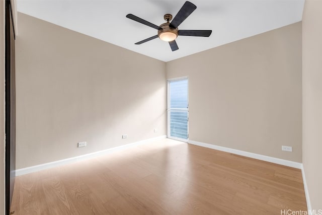 empty room featuring ceiling fan and light hardwood / wood-style flooring