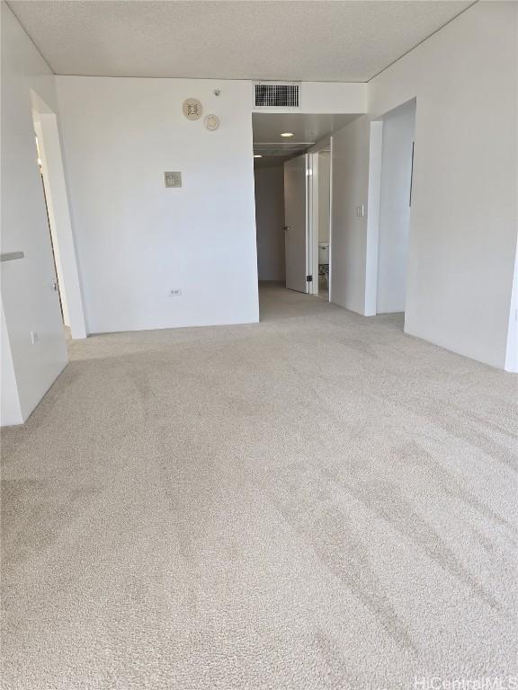 spare room featuring carpet flooring