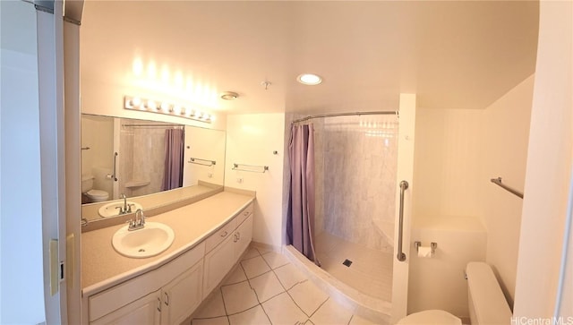 bathroom featuring a shower with shower curtain, radiator, vanity, tile patterned flooring, and toilet