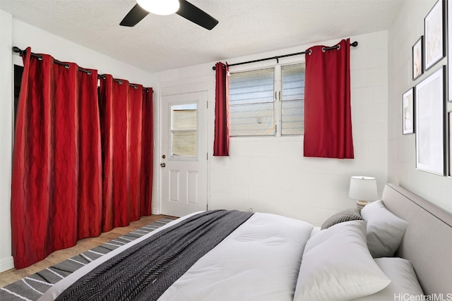 bedroom featuring a textured ceiling and ceiling fan