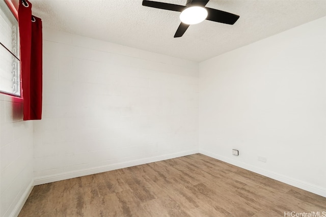 unfurnished room featuring hardwood / wood-style floors, a textured ceiling, and ceiling fan