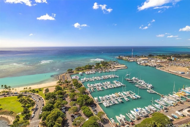 birds eye view of property with a water view and a view of the beach