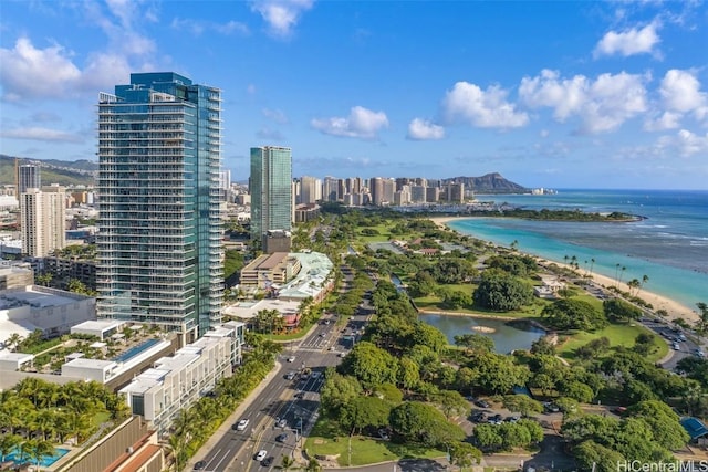 birds eye view of property featuring a view of the beach and a water view