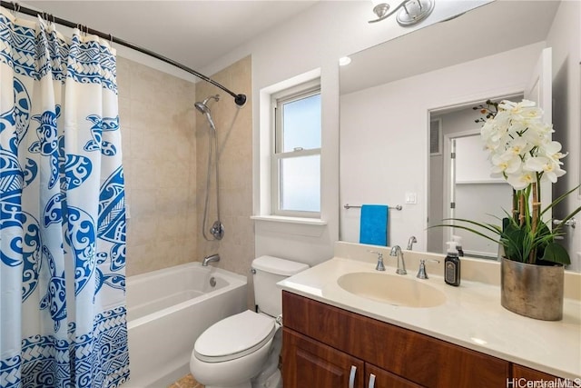 full bathroom featuring vanity, shower / bath combination with curtain, and toilet