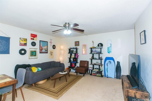 living room featuring carpet and ceiling fan