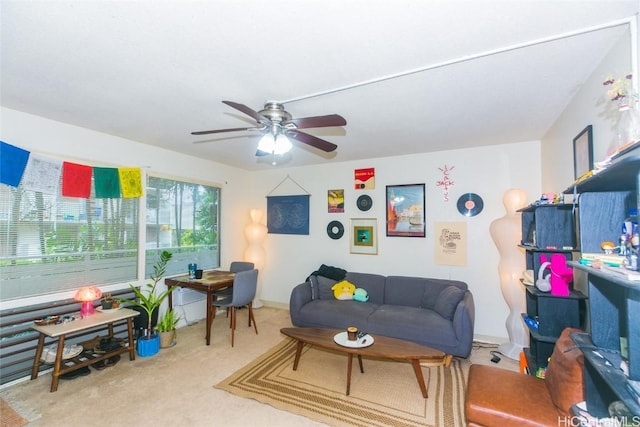 carpeted living room featuring ceiling fan