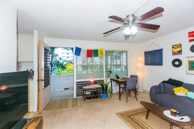 living room with ceiling fan and light carpet