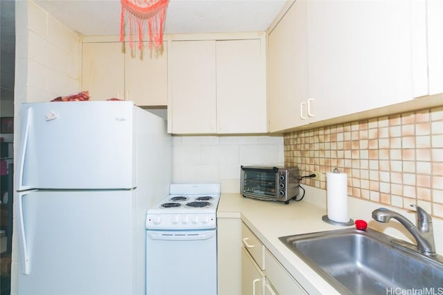 kitchen featuring white cabinets, decorative backsplash, white appliances, and sink