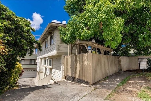 view of property exterior with a garage