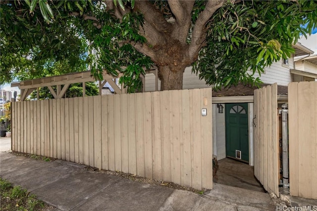 view of gate featuring a fenced front yard