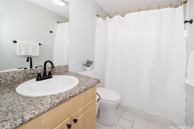 bathroom with tile patterned floors, toilet, and vanity