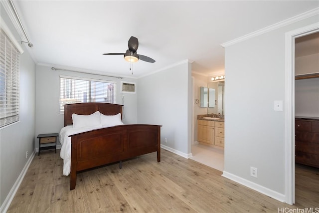 bedroom featuring connected bathroom, sink, ceiling fan, crown molding, and light hardwood / wood-style flooring