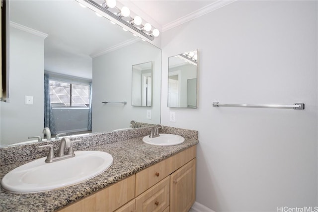 bathroom with ornamental molding and vanity