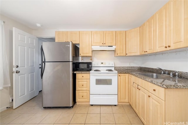 kitchen featuring sink, stainless steel refrigerator, electric range, light tile patterned flooring, and light brown cabinets