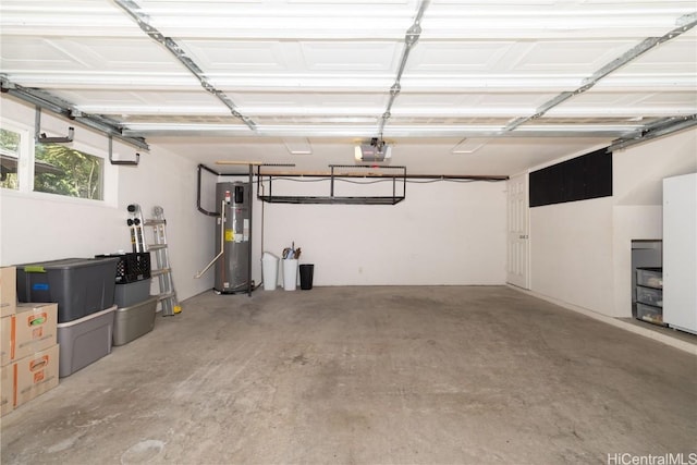 garage with a garage door opener and water heater