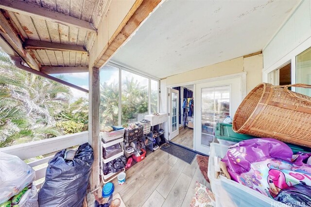 sunroom featuring wood ceiling