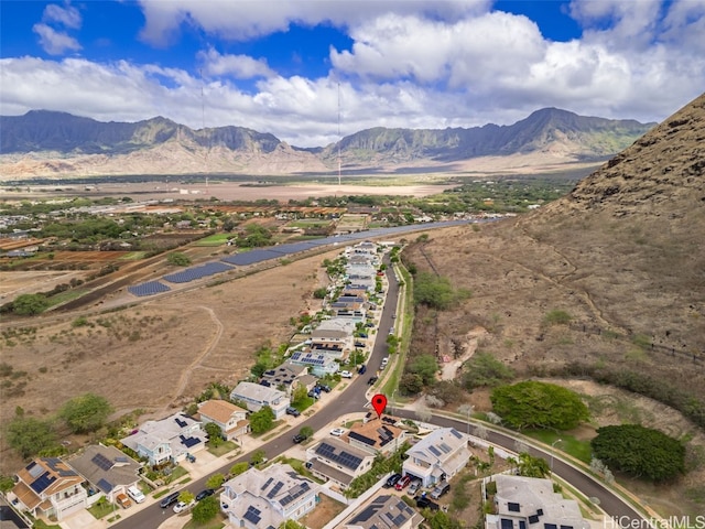 birds eye view of property with a mountain view