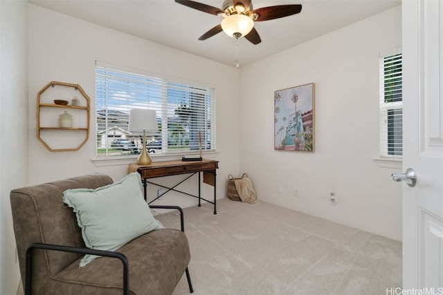 office space with light carpet and ceiling fan