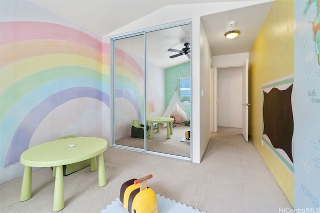 recreation room featuring ceiling fan, carpet, and lofted ceiling