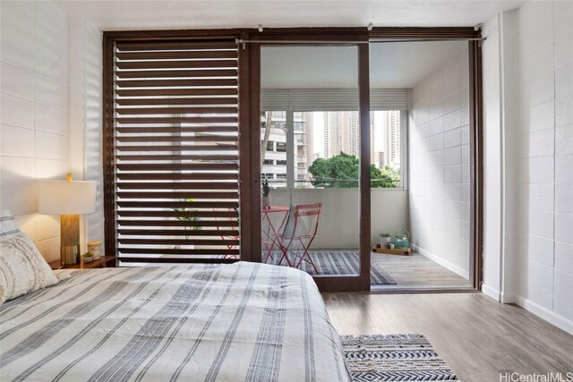 unfurnished bedroom with wood-type flooring