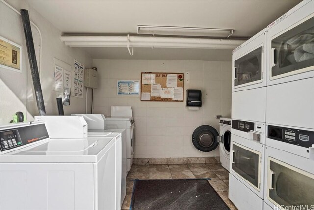 laundry area featuring washer and dryer and stacked washing maching and dryer