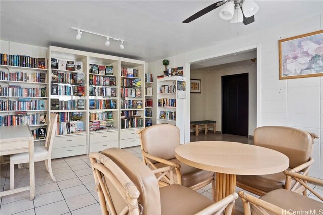 sitting room with ceiling fan and light tile patterned flooring